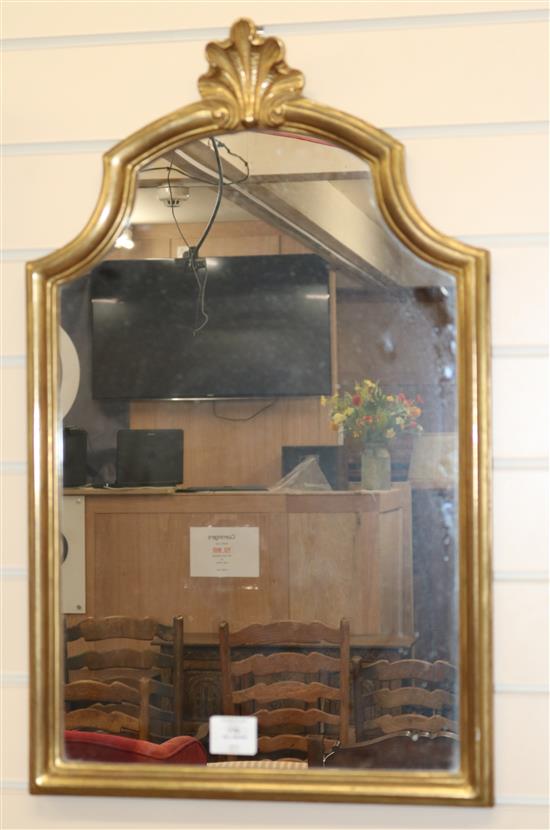 A gilt carved wood shaped topped wall mirror W.43cm